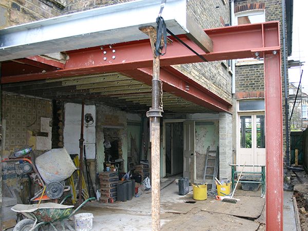 Beam welding London – welder working on structural steel beam on site