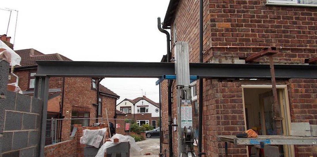 Close-up of structural beam welding in London on a steel connection
